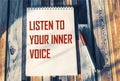 Listen to your inner voice - inspiring phrase on a notebook. Confidence, intuition