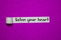 Listen your heart, Inspiration, Motivation and business concept on purple torn paper Royalty Free Stock Photo