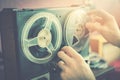 Listening old records on vintage audio reel recorder Royalty Free Stock Photo