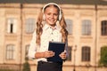 Listening school book. Digital technologies for learning. Elearning and modern methods. Girl cute schoolgirl hold book
