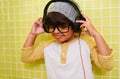 Listening to his favorite tunes. a cute little boy wearing headphones. Royalty Free Stock Photo