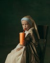 Medieval little girl as a lady with a pearl earring on dark studio background. Concept of comparison of eras, childhood