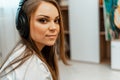 Listening to music. Young beautiful girl with big headphones on her head. Close-up. Leisure and music. Royalty Free Stock Photo