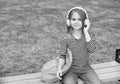 Listening to new tunes. Small kid listen to music summer outdoors. Listening comprehension. Audio learning. English Royalty Free Stock Photo