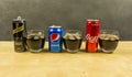 Listing a cola drink from producers: Pepsi, Coca-Cola and Schweppes. Cola presented in glasses with ice cubes.