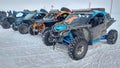 Listvyanka, Russia - February 29, 2020: Several buggy cars stand in the snow.