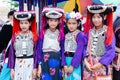 Lisu hill-tribe preteen girl wears traditional tribal attire with black circular Lisu headdress on Akha Swing Festival 2018