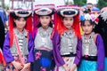 Lisu hill-tribe preteen girl wears traditional tribal attire with black circular Lisu headdress on Akha Swing Festival 2018