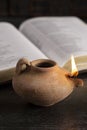 Lit Ancient Oil Lamp with an Open Bible Thy Word is a Lamp Unto My Feet Royalty Free Stock Photo