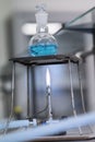 Lit bunsen in the chemistry laboratory Royalty Free Stock Photo