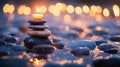 A Lit Candle Atop A Stack Of Stones Near Water Royalty Free Stock Photo