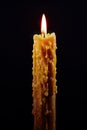 Lit candle on black Royalty Free Stock Photo