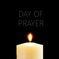 Lit candle and text day of prayer