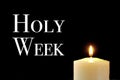 A lit candle and the text holy week