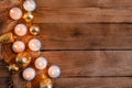 Lit candles, Christmas tree Golden baubles and burlap on a wooden background. New year`s flat layout with space for text Royalty Free Stock Photo