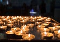 lit candles in church on black background Royalty Free Stock Photo