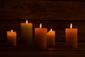 Lit candles in dark room