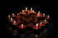 lit candles forming a heart shape in darkness Royalty Free Stock Photo
