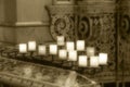 Lit candles inside a church, detail