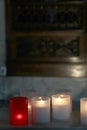 Lit candles inside a church, detail