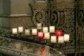 Lit candles inside a church, detail