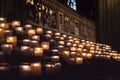 Lit Candles inside church Notre Dame de Paris, France Royalty Free Stock Photo