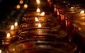 Lit Candles inside Duomo Cathedral. Milano