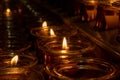 Lit Candles inside Duomo Cathedral. Milano