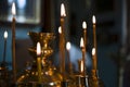 Lit candles in racks in a historic church Royalty Free Stock Photo