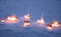 The lit candles on the street