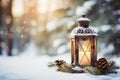 Lit Christmas lantern under the Christmas tree in the snow, covered with snow at night outdoors. Christmas mood. Selective focus.