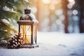 Lit Christmas lantern under the Christmas tree in the snow, covered with snow at night outdoors. Christmas mood. Selective focus.