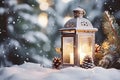 Lit Christmas lantern under the Christmas tree in the snow, covered with snow at night outdoors. Christmas mood. Selective focus.