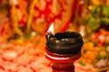 Lit clay lamp on top of a clay stand or worship idol durgapuja india diwali