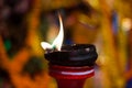 Lit clay lamp on top of a clay stand or worship idol durgapuja india diwali