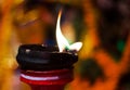 Lit clay lamp on top of a clay stand or worship idol durgapuja india diwali