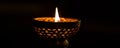 Lit decorative candle in a dark setting, close-up. Tranquil and serene ambiance concept Royalty Free Stock Photo