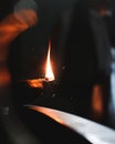 A lit dia with a single flame in the time of diwali