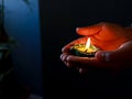 A girl holding diya to celebrate diwali and dhanteras Royalty Free Stock Photo