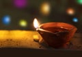 Lit diya lamp on street at night or beautiful diwali lighting, selective focus. clay diya lamps lit during diwali Royalty Free Stock Photo