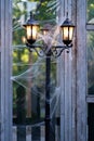 The lit electric lantern is wrapped in cobwebs Royalty Free Stock Photo