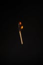 Lit falling match on a black background Royalty Free Stock Photo