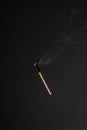 Lit falling match on a black background Royalty Free Stock Photo
