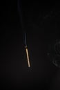 Lit falling match on a black background Royalty Free Stock Photo
