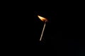 Lit falling match on a black background Royalty Free Stock Photo