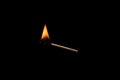 Lit falling match on a black background Royalty Free Stock Photo