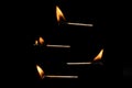 Lit falling match on a black background Royalty Free Stock Photo