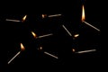 Lit falling match on a black background Royalty Free Stock Photo