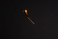 Lit falling match on a black background Royalty Free Stock Photo