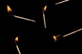 Lit falling match on a black background Royalty Free Stock Photo